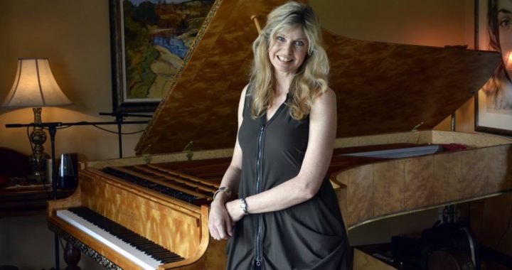 Busy calendar: Fiona Joy with her much-loved Stuart & Sons concert grand piano. Photo - PETER GLEESON